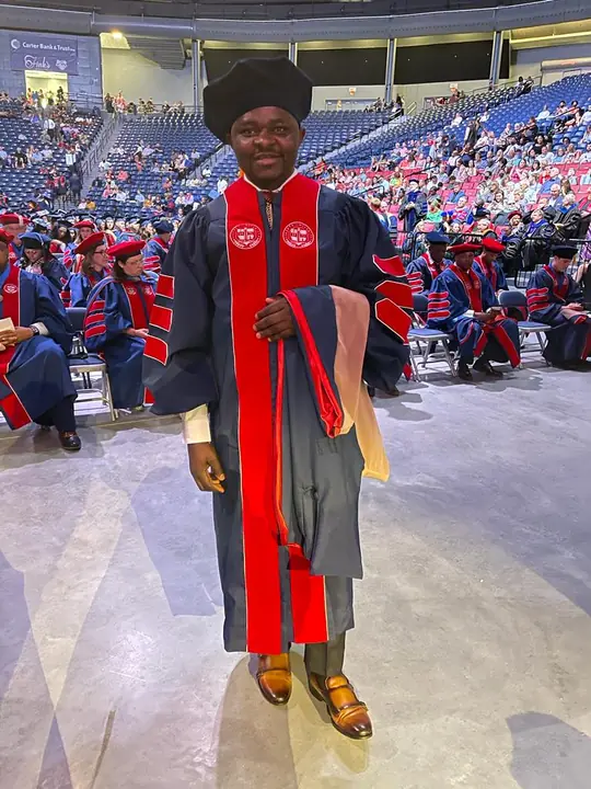 Member in doctoral graduation regalia at commencement