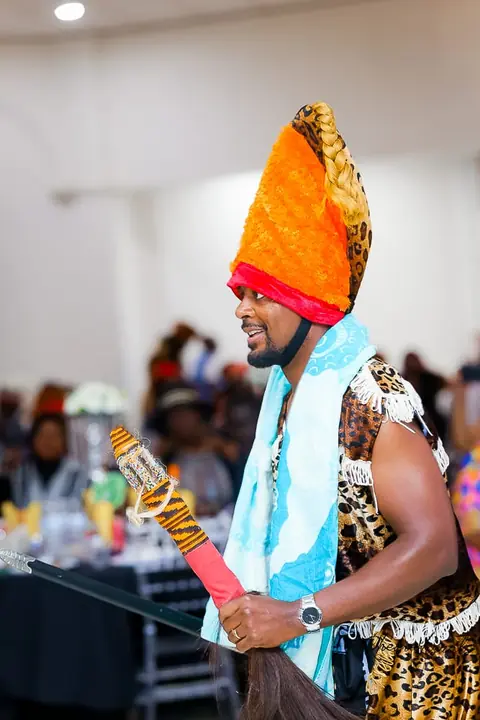 Member in traditional dress at a cultural celebration
