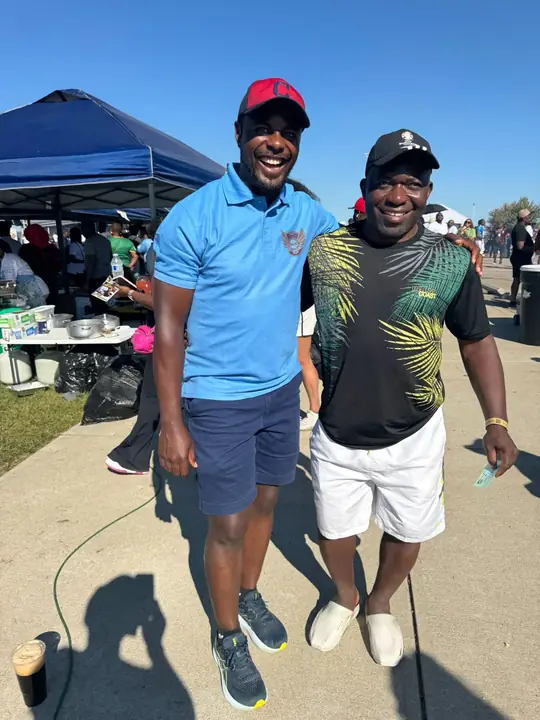 Two members smiling at a club event