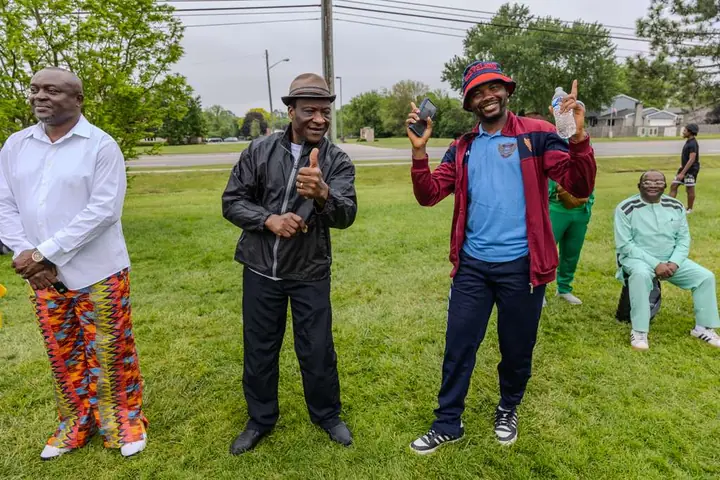Members giving a thumbs up at an outdoor club event
