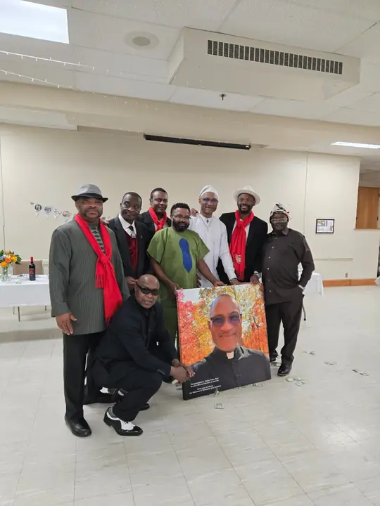 CAVFC members in club scarves presenting a portrait to Father Peter Paul for his 25th anniversary